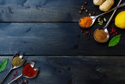 Healthy eating Background with herbs and spices selection on dark wooden table. Food or cooking concept, top view.