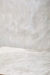 Photography of a light grey and white marble surface for food photography or similar. Low angled view.