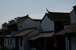 Traditional houses of southeast China: vintage architecure style with black roof and white wall.  