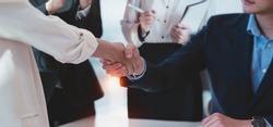 Business people handshake for teamwork of business, finishing up meeting, business etiquette, congratulation, merger and acquisition concept.