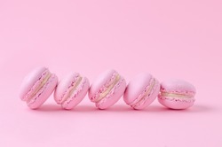 pink macaroons on pink background, homemade food
