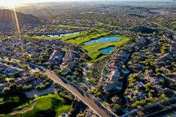 a aerial high definition shot of a golf course in Arizona during the winter.