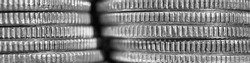 Stacks of US American coins of 25 cents quarters closeup. Black and white banner about economy finance banks in the United States. Old money headline. Macro