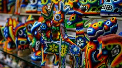 Colorful hand made animals souvenirs for house decoration. Selective focus