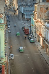 Old American car in Havana Cuba with old buildings
