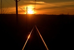 railway tracks in the soft light of the setting sun