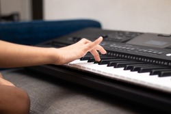 Nimble fingers Of Kid Playing Notes On Piano Or Keyboard. Musical Training Or Coaching, Learning, Home Activity, Amusement, Live Music Concert, Entertainment, Leisure And Hobby, Summer Camp Concept