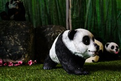 panda statue in its habitat