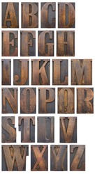 An alphabet of wooden printers' blocks silhouetted.