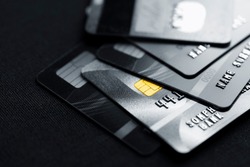 Stack credit cards, close up view with selective focus for background. Online credit card payment for purchases from online shopping.