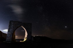 Slow shutter speed starry sky above the ruins of Grosnez Castle in Jersey Channel Islands