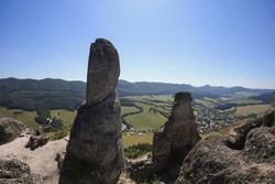 Sulovsky hrad, Sulov Casttle, Slovakia - ruins and remains of old historical building on the top of rock. Landscape with mountains and hills. Wide angle distortion with soft corners.