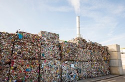 Waste-to-energy or energy-from-waste is the process of generating energy in the form of electricity or heat from the primary treatment of waste. Cubes of pressed metal beer and soda cans.