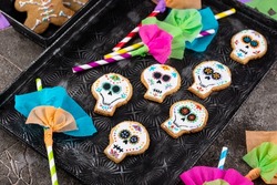 Day of the Dead cookies in shape of sugar skull. Mexican Halloween Dia de los Muertos