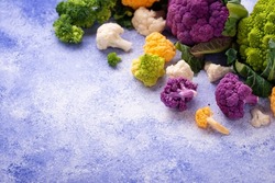 Various sort of cauliflower. Purple, yellow, white and green color cabbages. Broccoli and Romanesco