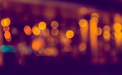 image of blurred bokeh background with warm colorful lights. (vintage tone)