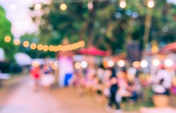 Abstract Blurred image of  day market  in garden for background usage . (vintage tone)