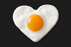 heart made of fried egg on teflon pan