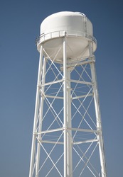 Water tower against blue sky
