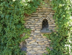 Stonework with a small window in the park