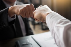 Business Partners Giving Fist Bump to  commitment Greeting Start up new project or complete mission successful deal together with strong teamwork. startup concept