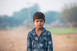 Indian little poor boy giving expression.