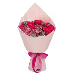 Bunch of red bouquet of flowers in a pink paper wrap cone isolated on white background