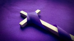 Good Friday, Lent Season and Holy Week concept - A Christian cross on purple background. Conceptual