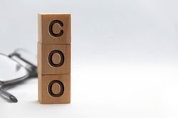 COO text representing Chief Operating Officer engraved on wooden blocks with customizable space for text. Copy space and Senior Management concept.