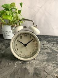 alarm clock on vintage background