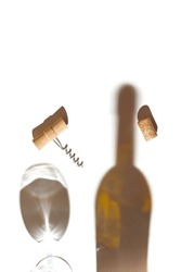 Creative composition made of corkscrew and cork of wine on white background with glass and bottle shadows. Date, party and celebration concept. Top view. Flat lay