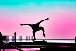 skateborder silhouette jumping in a skatepark