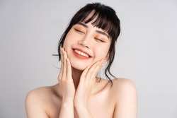 Portrait of young Asian woman with beautiful skin and smile