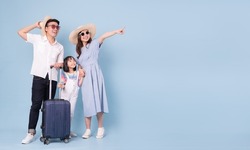 Image of young Asian family travel concept background