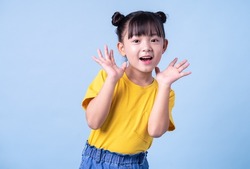 Image of Asian child posing on blue background