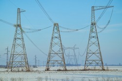 High voltage post.High-voltage tower with in field.High-voltage power lines. Electricity distribution station. high voltage electric transmission tower. Distribution electric substation with power