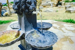Ancient Drinking fountain. Roman old traditional water fountain