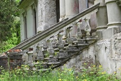 the old abandoned manor was once a chic outdoor staircase