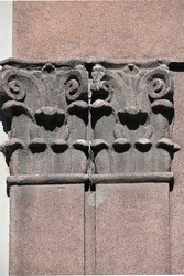 detail of the semi-colons of the historical building with capitals decorated with plant motifs