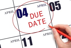 4th day of April. Hand writing text DUE DATE on calendar date April 4 and circling it. Payment due date. Business concept. Spring month, day of the year concept.