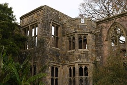 old English castle ruins with no windows and medieval stonework