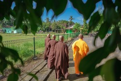 Buddhist monk and buddhist buddhist walking together.