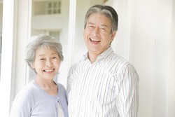 A laughing elderly couple