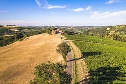 Aerial view of countryroad in the Oltrepo' Pavese in Lombardy in a sunny day