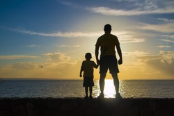 Father and son silhouette in the Amazon
