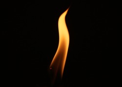 Small fire isolated on a black background.