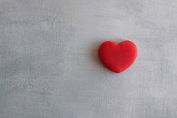 Top view image of red heart on concrete floor with copy space