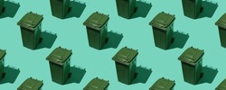 Pattern from dumpsters on a green background can be used as a background. The concept of ecology and waste sorting.