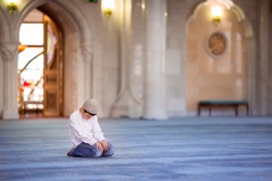 little boy in the mosque read the Quran
