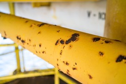 Close-up of corroded steel pipe, corrosion of steel, general corrosion, offshore petroleum pipelines.